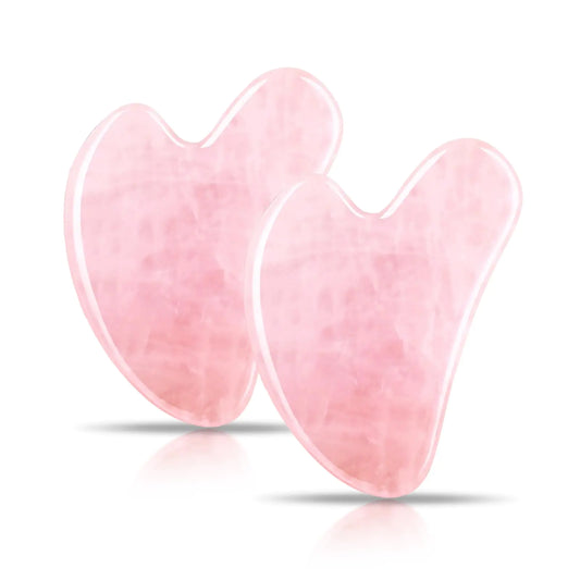 Two pink heart-shaped gel pads on a white background