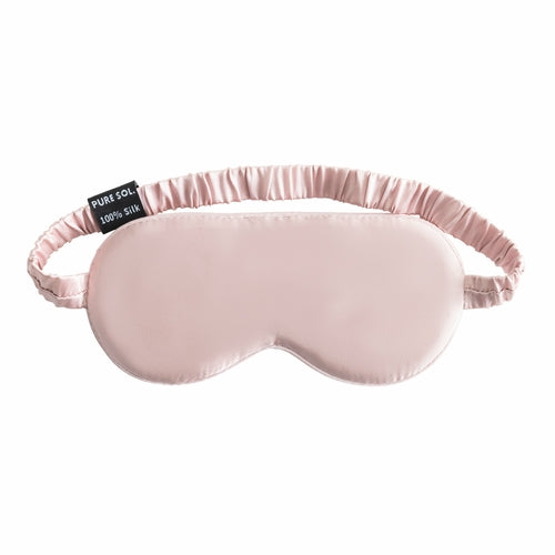 Pink satin sleep mask with 'PURE SOL' label on a white background